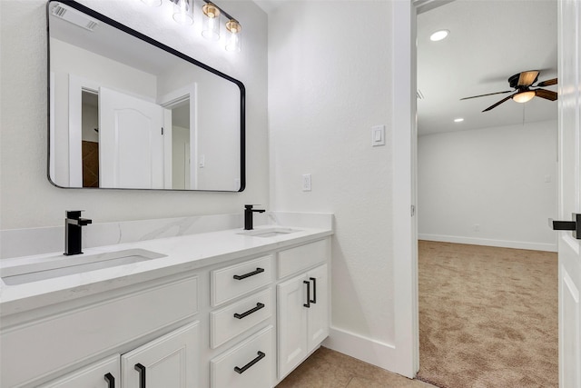 bathroom with ceiling fan and vanity