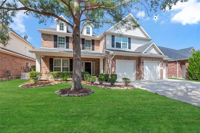 view of front of property featuring a garage, a front lawn, and cooling unit