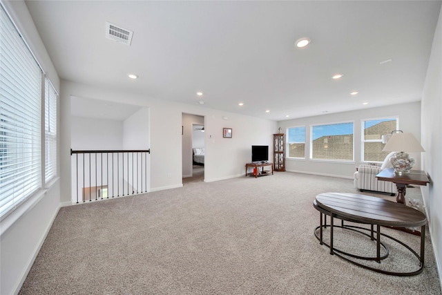 carpeted living room with radiator