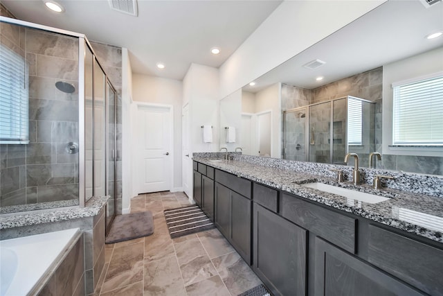 bathroom featuring vanity and plus walk in shower