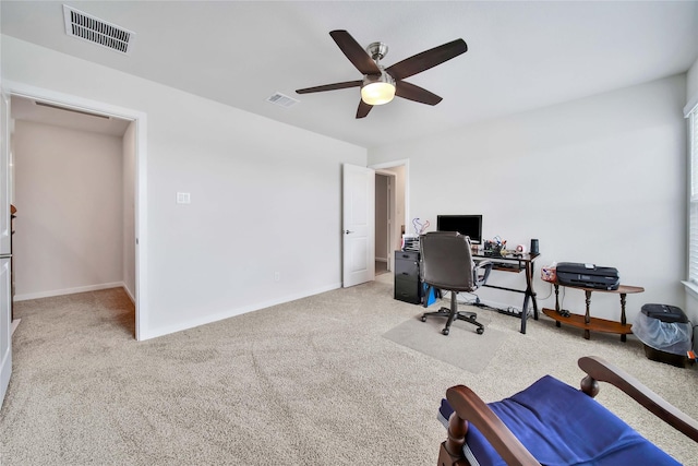 office with ceiling fan and light colored carpet