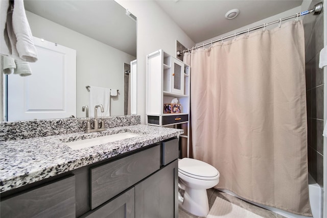 full bathroom with shower / bath combo with shower curtain, vanity, and toilet