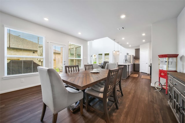 dining area with dark hardwood / wood-style floors