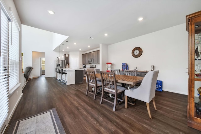 dining space with dark wood-type flooring