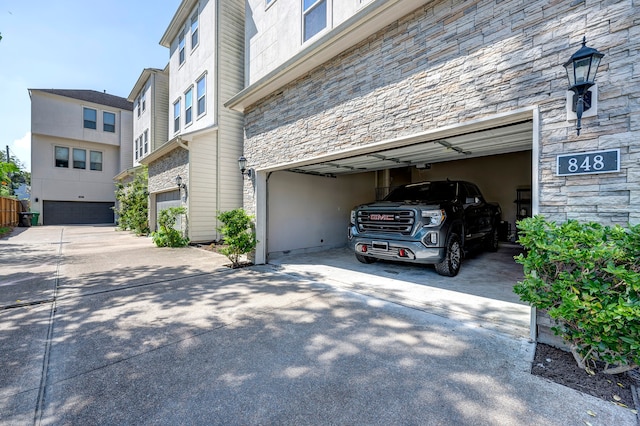 view of side of home with a garage