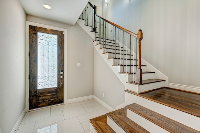 entrance foyer with light tile patterned flooring