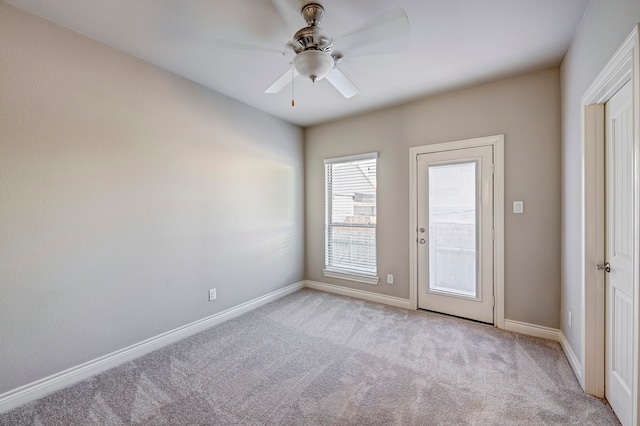 unfurnished room with light carpet and ceiling fan