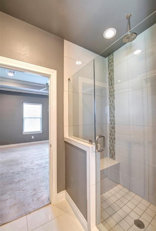 bathroom with tile patterned floors and a shower with shower door