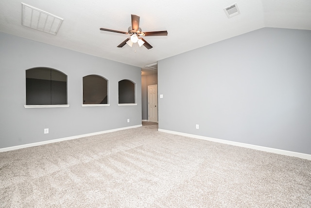 spare room with lofted ceiling, ceiling fan, and carpet floors