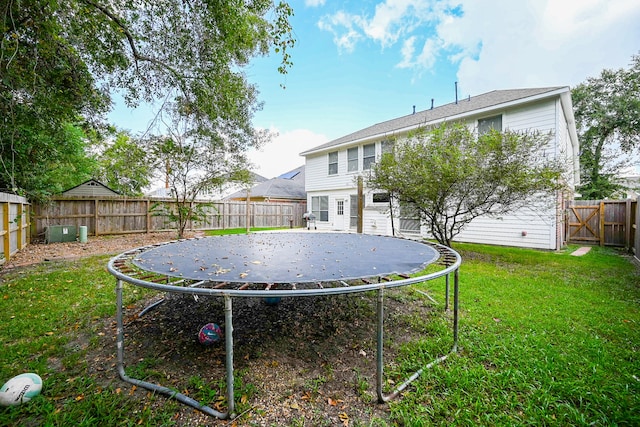 view of yard with a trampoline