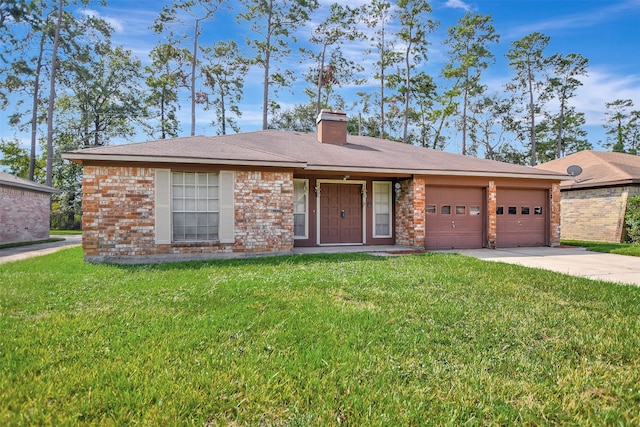 single story home with a garage and a front lawn