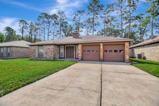 ranch-style home with cooling unit, a front yard, and a garage