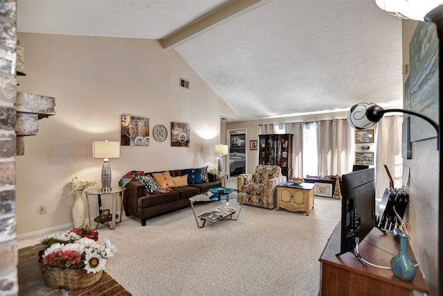 carpeted living room with lofted ceiling with beams