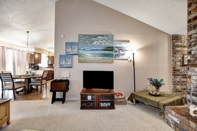 carpeted living room featuring a notable chandelier, lofted ceiling, and a textured ceiling