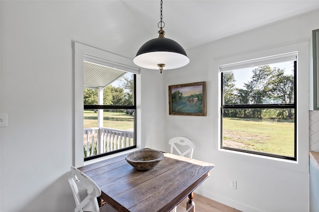 dining space with light wood-type flooring