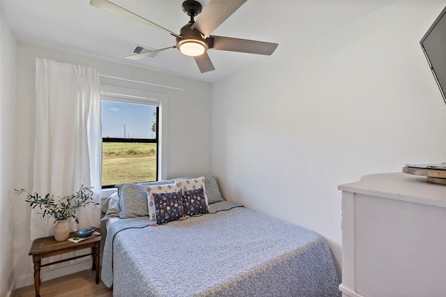 bedroom featuring wood-type flooring and ceiling fan