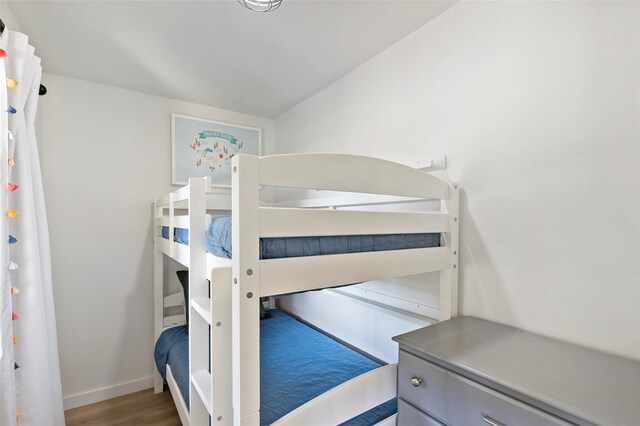 bedroom with hardwood / wood-style flooring