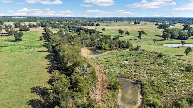 birds eye view of property with a water view and a rural view