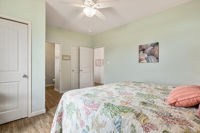 bedroom with ceiling fan and hardwood / wood-style floors