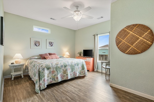 bedroom with hardwood / wood-style floors and ceiling fan