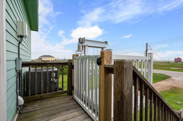 wooden deck featuring central air condition unit