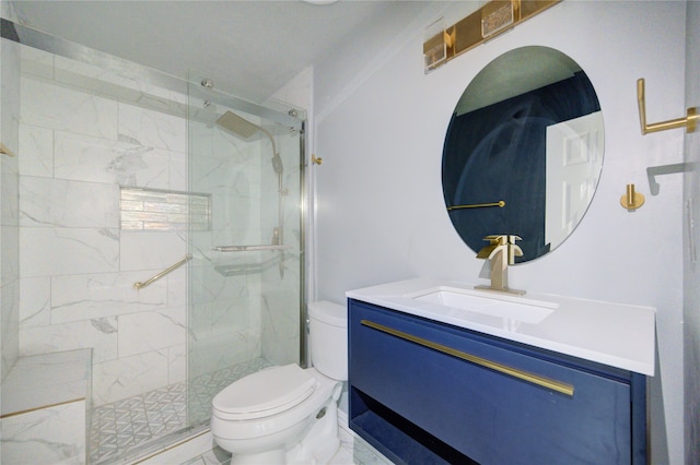 bathroom featuring vanity, an enclosed shower, and toilet