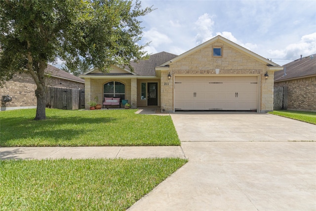 view of front facade with a front yard and a garage