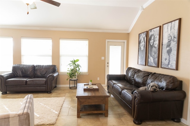 tiled living room with lofted ceiling, ornamental molding, and ceiling fan