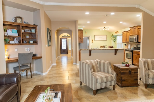 tiled living room featuring ornamental molding