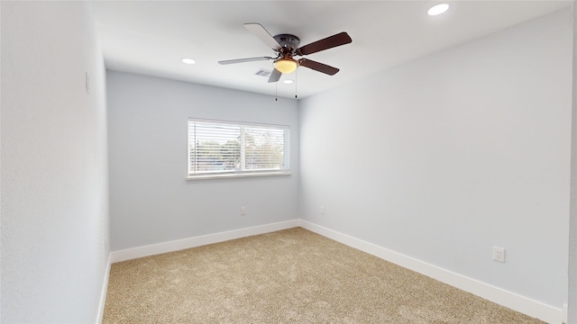 carpeted empty room featuring ceiling fan