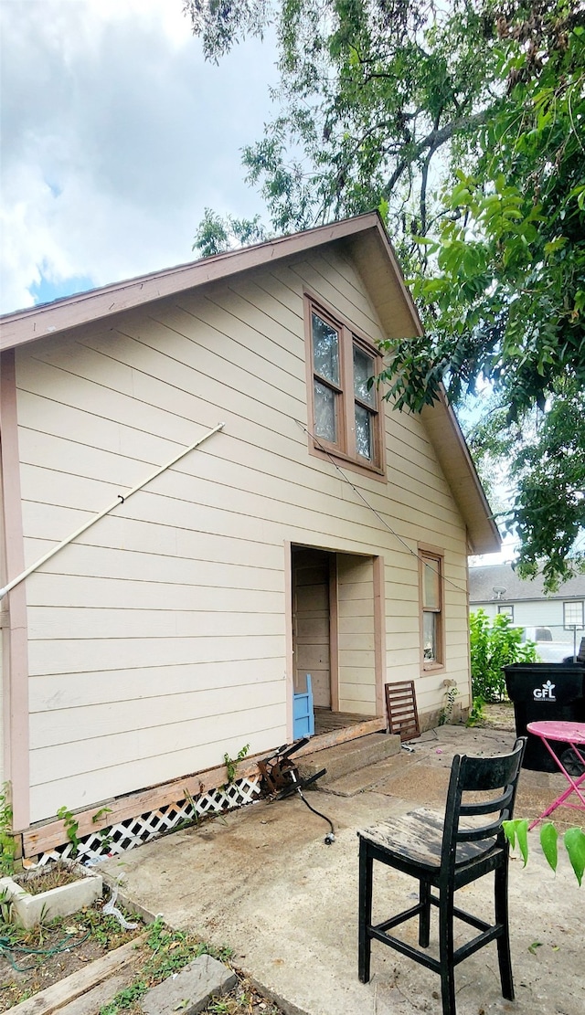 rear view of property featuring a patio