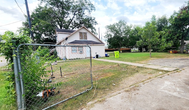 exterior space with a lawn and fence