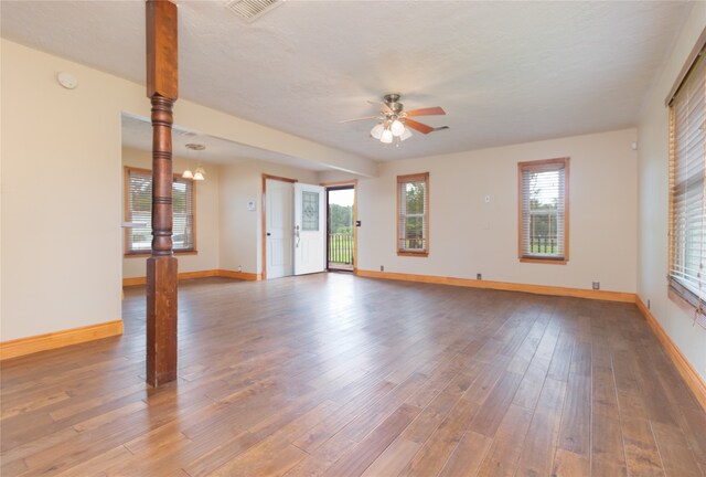 unfurnished room featuring ceiling fan and hardwood / wood-style floors