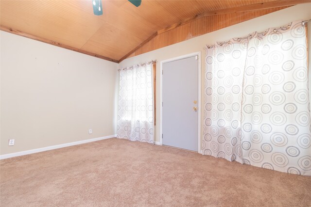 unfurnished room with wood ceiling, vaulted ceiling, ceiling fan, and carpet floors