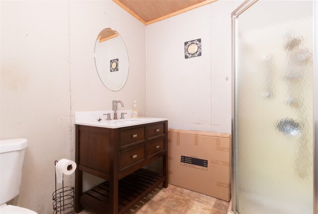 bathroom with vanity, toilet, and an enclosed shower