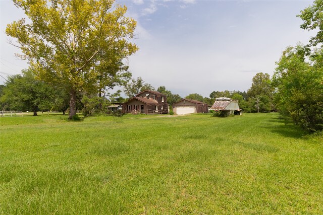 view of yard with a garage