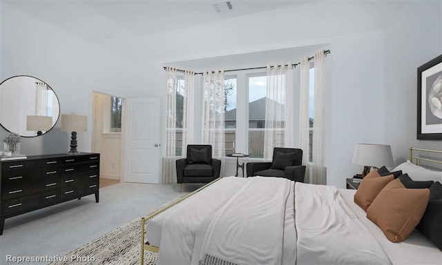 bedroom featuring light colored carpet