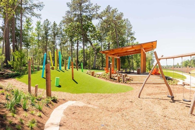 community playground featuring a lawn