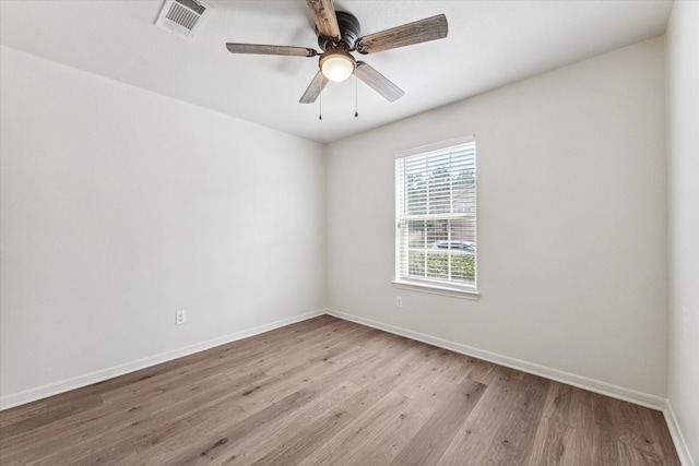 unfurnished room with light wood-type flooring and ceiling fan