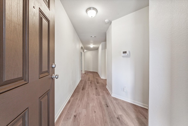 corridor featuring light wood-type flooring