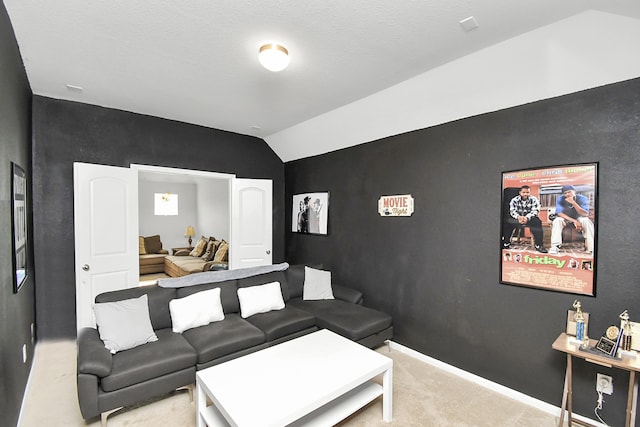 carpeted living room featuring vaulted ceiling