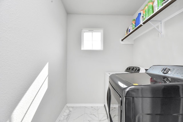 washroom featuring washing machine and clothes dryer