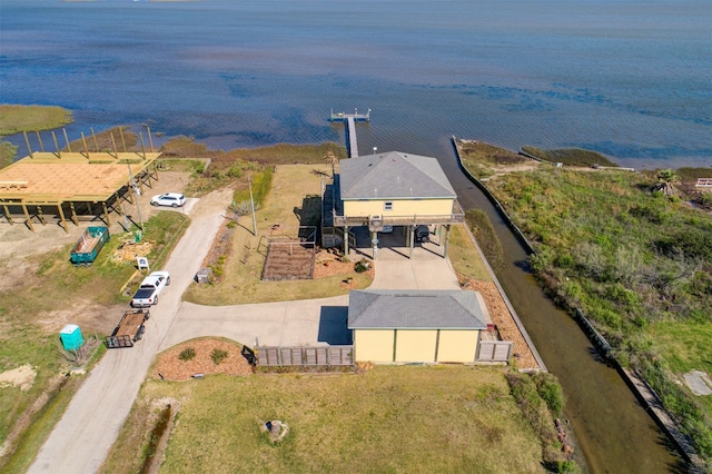 birds eye view of property with a water view