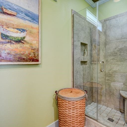 bathroom featuring a shower with shower door