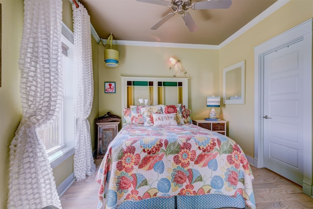 bedroom with ceiling fan, light hardwood / wood-style flooring, and crown molding