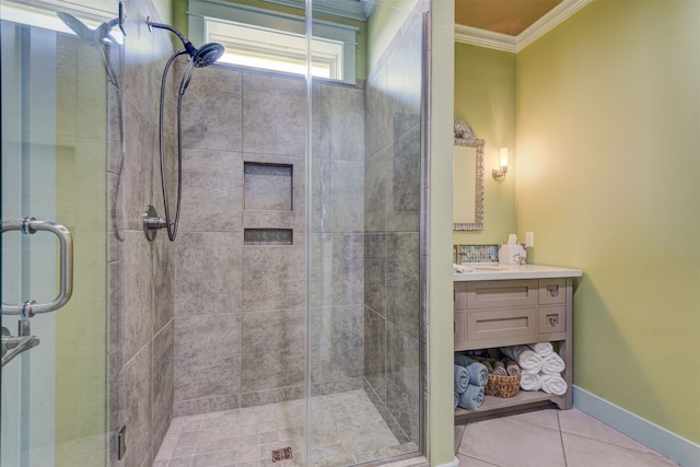 1038 Elizabeth St, Gilchrist, TX 77617 - bathroom with ornamental molding, tile patterned floors, a shower stall, vanity, and baseboards