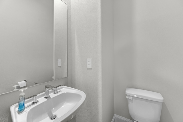 bathroom with sink and toilet