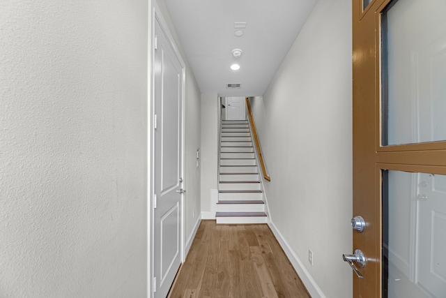 corridor with light wood-type flooring