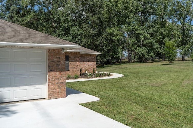 view of yard featuring a garage