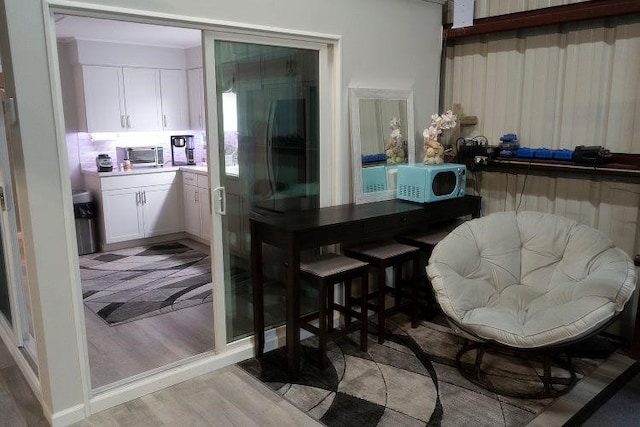 dining space featuring light hardwood / wood-style floors